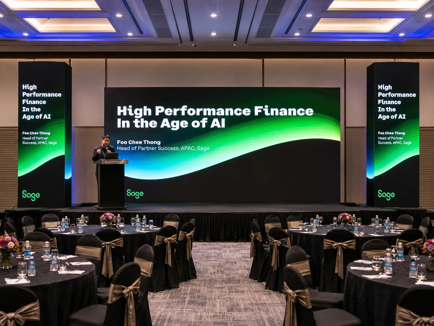 Sage Malaysia conference – LED screen and matching portrait pillars displaying "High Performance Finance in the Age of AI"